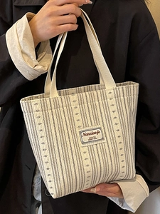 Chic 2024 canvas tote bag with black stripes and Nanciaojie label for women fashion