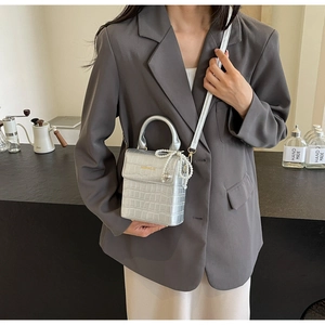 Silver crocodile pattern mini bag with pearl heart charm and metallic crossbody strap