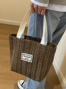 Brown striped corduroy tote bag with white handles and letter patch for daily fashion