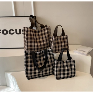 Detailed close-up of premium plaid tote bags in two sizes with canvas strap and metal clasp