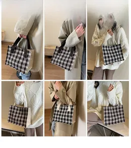 Detail of checkered tote bag with woven texture and stylish handles for daily use
