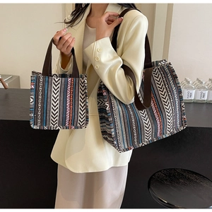 Detailed close-up of large ethnic weave tote bag with bohemian geometric pattern