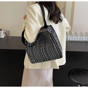 Ethnic style tote bag with black and white geometric patterns on canvas fabric