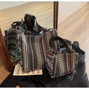 Ethnic style woven tote bag set with deep blue and red patterns and brown straps