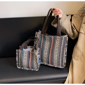 Detailed comparison of large and small ethnic woven tote bags with geometric patterns