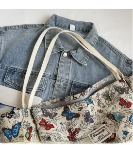 Detail of high-density butterfly jacquard canvas tote showing durable woven handles