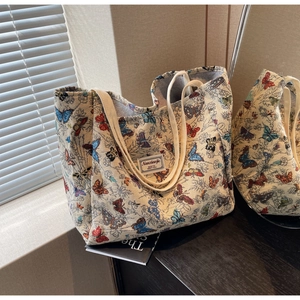 Close-up of butterfly jacquard pattern and premium canvas texture on tote bag