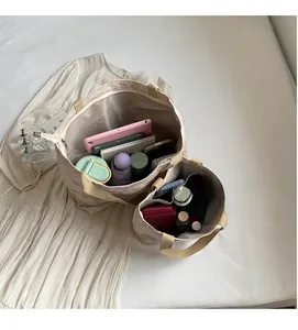 Internal view of large and small tote bags showing ample capacity for tablets and daily items