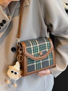 Retro brown leather and plaid crossbody bag with a cute monster plush charm for women