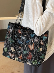 Fashionable black butterfly jacquard tote bag with chain strap and leather branding label