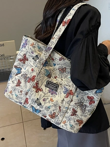 Large capacity butterfly pattern tote bag in vintage cream canvas for fashion commuters