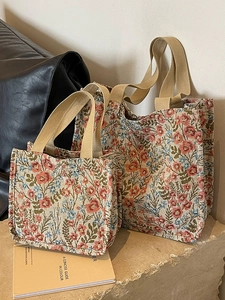 Large floral canvas tote bag in vintage style with textured fabric and ribbon handles