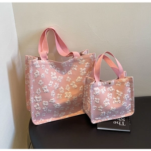 Pink canvas tote set featuring 3D floral texture and mini pouch with metal snap button