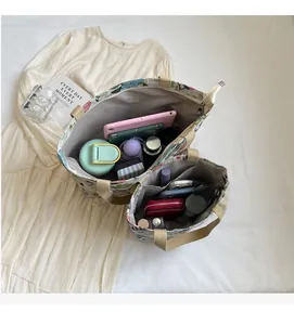 Detailed interior view of floral canvas tote bag showing large capacity and multi-pockets