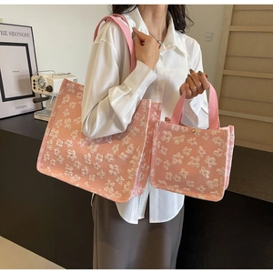 Detailed comparison of pink floral jacquard tote bags in large and small sizes