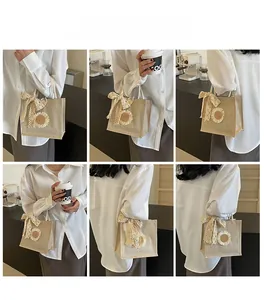 Detailed views of the beige linen tote bag featuring delicate lace bows and floral motifs