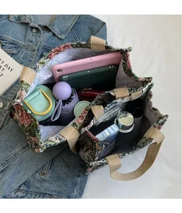 Top view of large ethnic tote bag with floral patterns showing spacious multi-compartment interior