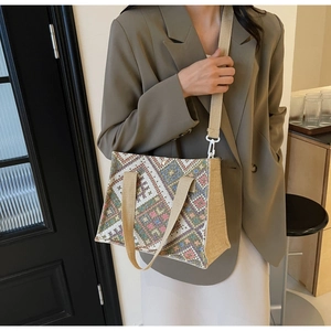 Ethnic pattern woven tote bag crossbody style styled with casual olive blazer
