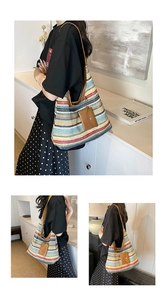 Detail of colorful striped woven tote with leather strap and removable pouch