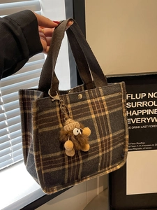 Retro plaid canvas tote bag in wool texture with a cute plush monster charm accessory