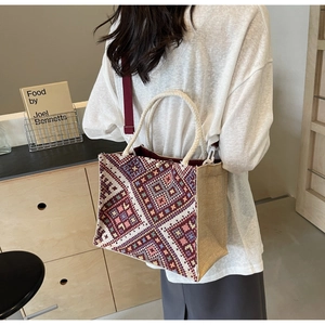 Ethnic bohemian tote bag with geometric texture, woven rope handles and red strap