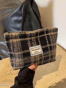Chic black and brown checkered wool cosmetic bag with metal zipper and premium fabric label