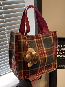 Large plaid canvas tote bag in red and yellow with a cute brown monster plush charm