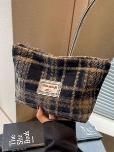 Vintage checkered tweed makeup bag in navy and brown with a metal zipper closure