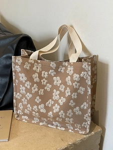 Vintage brown canvas tote bag with 3D white floral texture and dual top handles