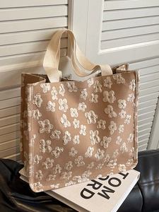 Chic khaki canvas tote bag with 3D floral texture and cream straps for daily commute