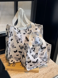 Minimalist canvas tote bag set with black butterfly prints on white fabric for women