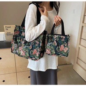 Detail view of ethnic floral jacquard tote bags in large and small sizes with handles