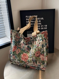 Ethnic style jacquard tote bag with floral patterns and sturdy beige handles for daily use