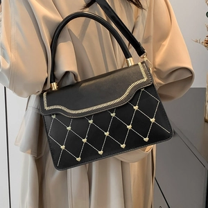 Chic black crossbody bag with gold heart embroidery and chain strap for women