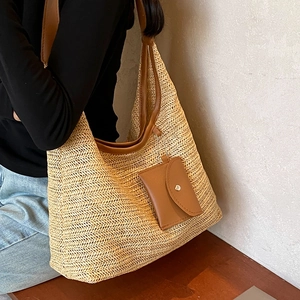 Large hand-woven straw tote bag with brown PU straps and a leather coin purse accessory