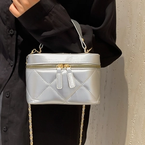 Silver quilted crossbody phone bag with gold chain strap and top handle for women