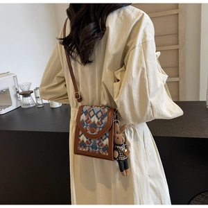 Vertical cross-body phone bag with plaid pattern and cute rabbit plush charm detail