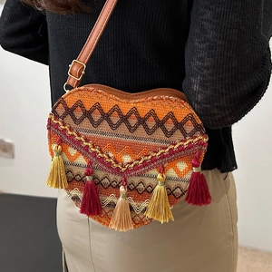 Ethnic woven heart crossbody bag with geometric embroidery and colorful tassels