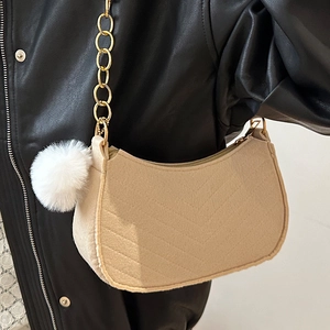 Fashionable khaki felt crescent underarm bag with gold chain and white pompom detail