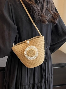 Handmade woven crossbody bag in khaki featuring a white daisy and pearl buckle closure