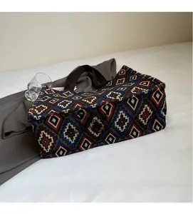 Detail of bohemian jacquard woven tote bag showing ethnic geometric diamond patterns