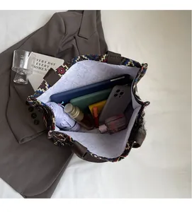 Interior view showing large capacity for tablet, umbrella and daily essentials in a tote bag