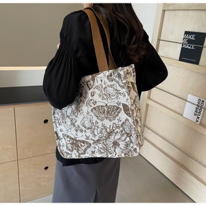 Detail of vintage butterfly and floral prints on large capacity canvas tote bag