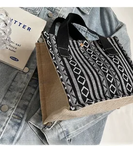 Detail of ethnic woven tote bag with geometric patterns and natural linen side texture