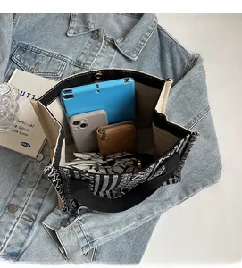Interior view of ethnic canvas tote bag showing large capacity for tablet and essentials