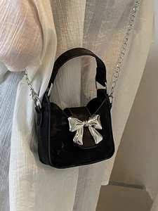 Mini black leather handbag with silver bow metal buckle and chain shoulder strap