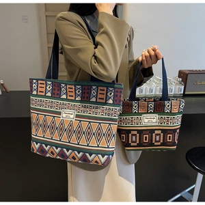 Detail of ethnic geometric pattern canvas bucket bag with sturdy handles and texture