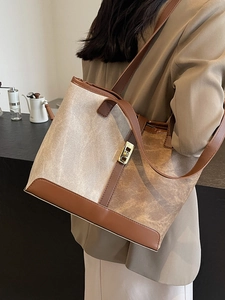Vintage patchwork tote bag with beige and dark brown panels and metallic lock for women
