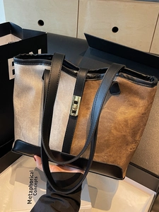 Retro color-block tote bag in beige and brown canvas with black leather trim and gold buckle