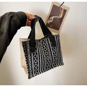 Detail of ethnic tote bag showing black and white geometric patterns and canvas texture